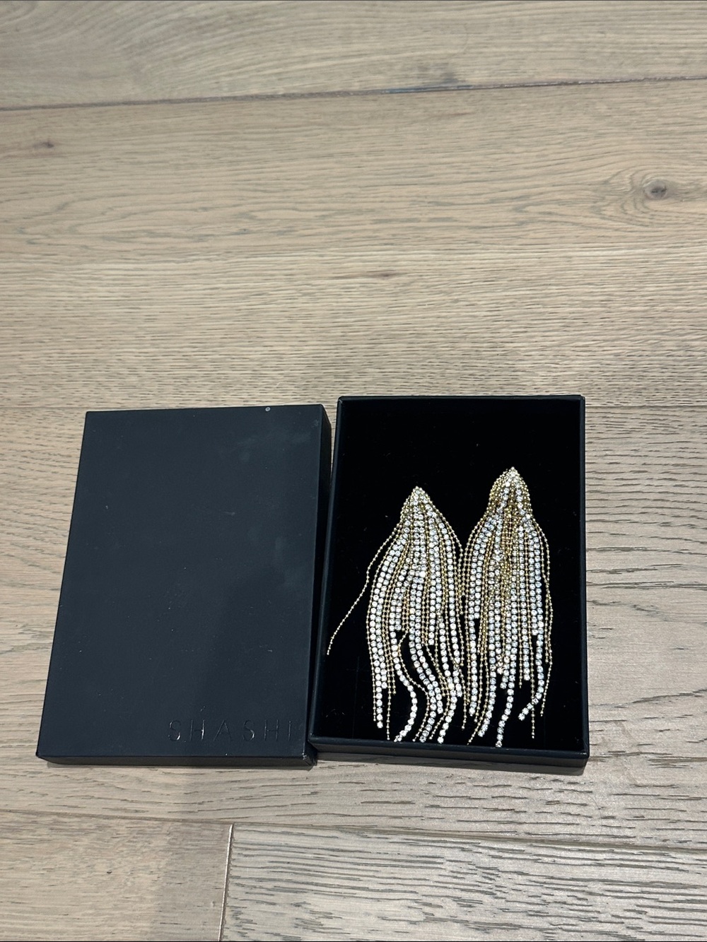 SHASHI Gold and Clear Crystal Tassel Earrings